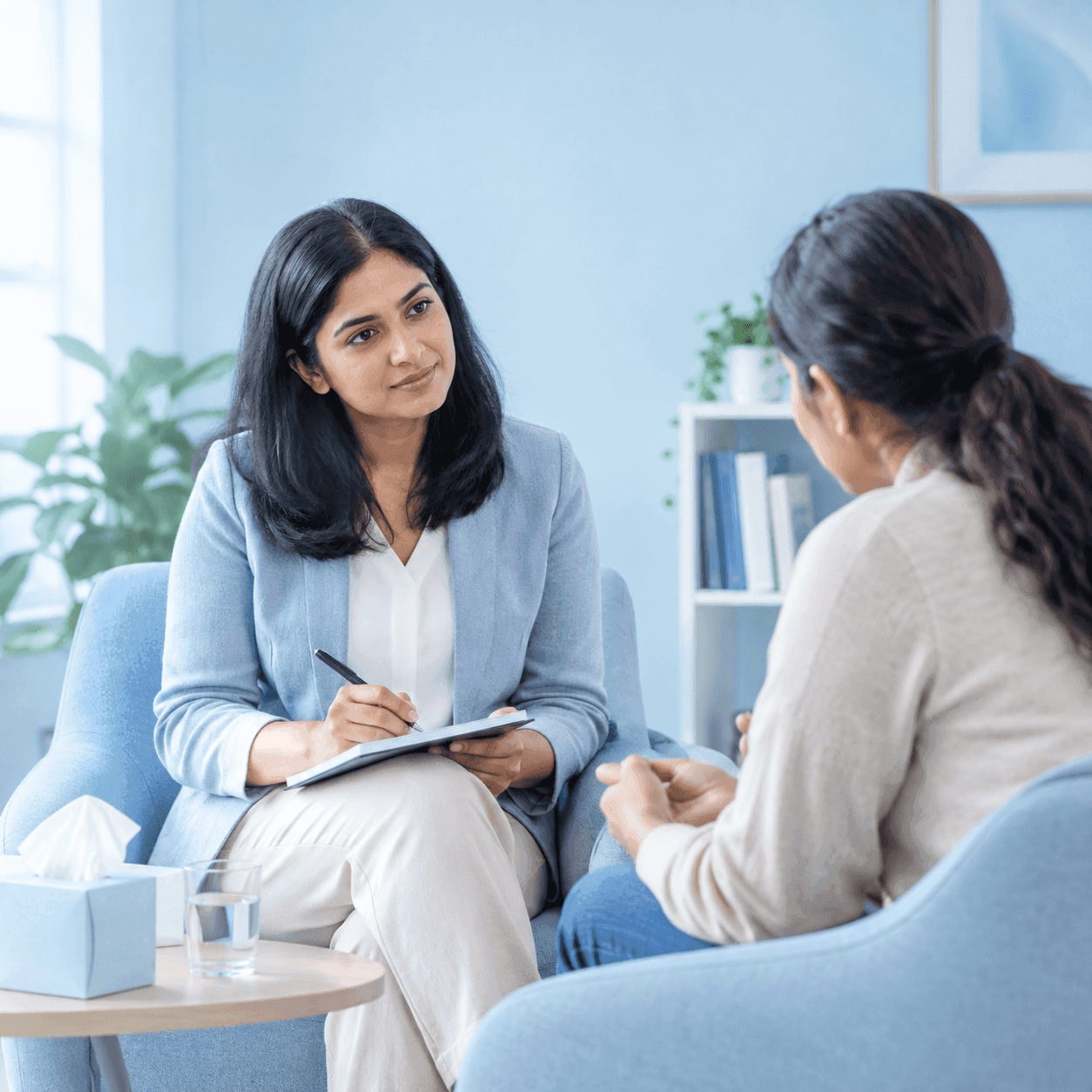 A clinician talking with a patient